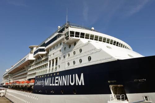 A close-up view of the Celebrity Millennium's bow and multiple passenger decks docked in port.