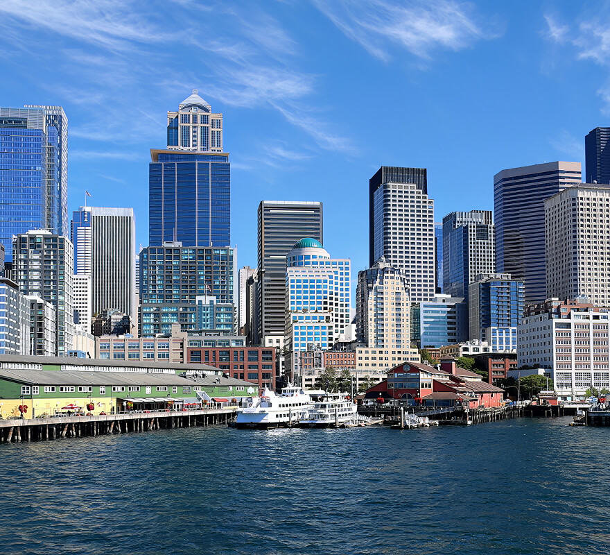 Seattle downtown waterfront with Pike Place Market and colorful pier buildings viewed from the water
